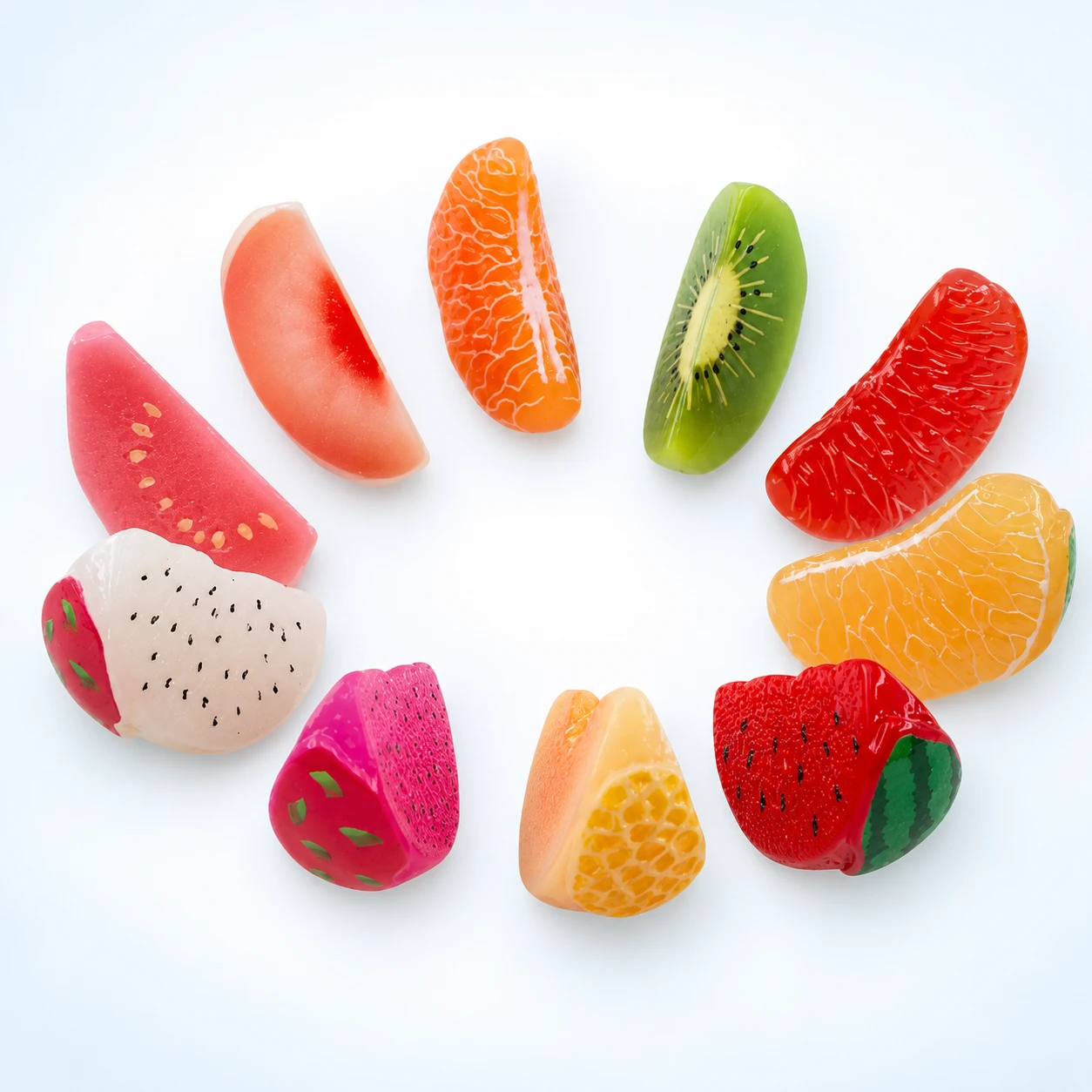 Assorted Fruit Wedge Resin Charms RW0027019 on a clean light studio background