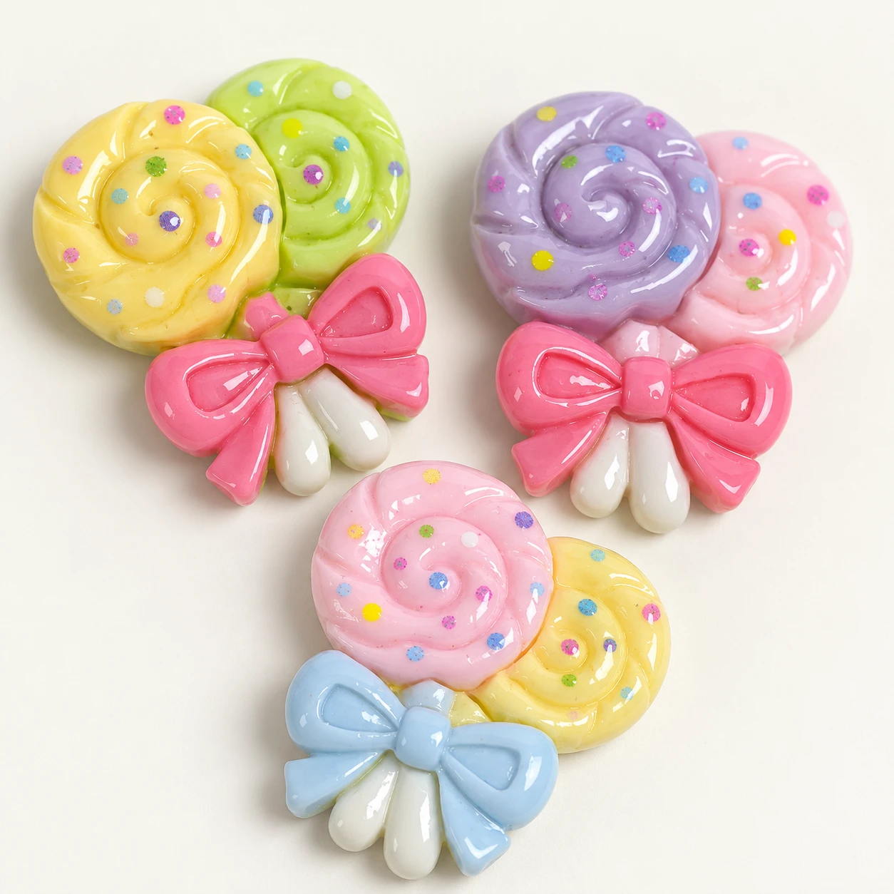 Bow Lollipop Resin Charms RW003564 close-up showing the decorative shape and finish