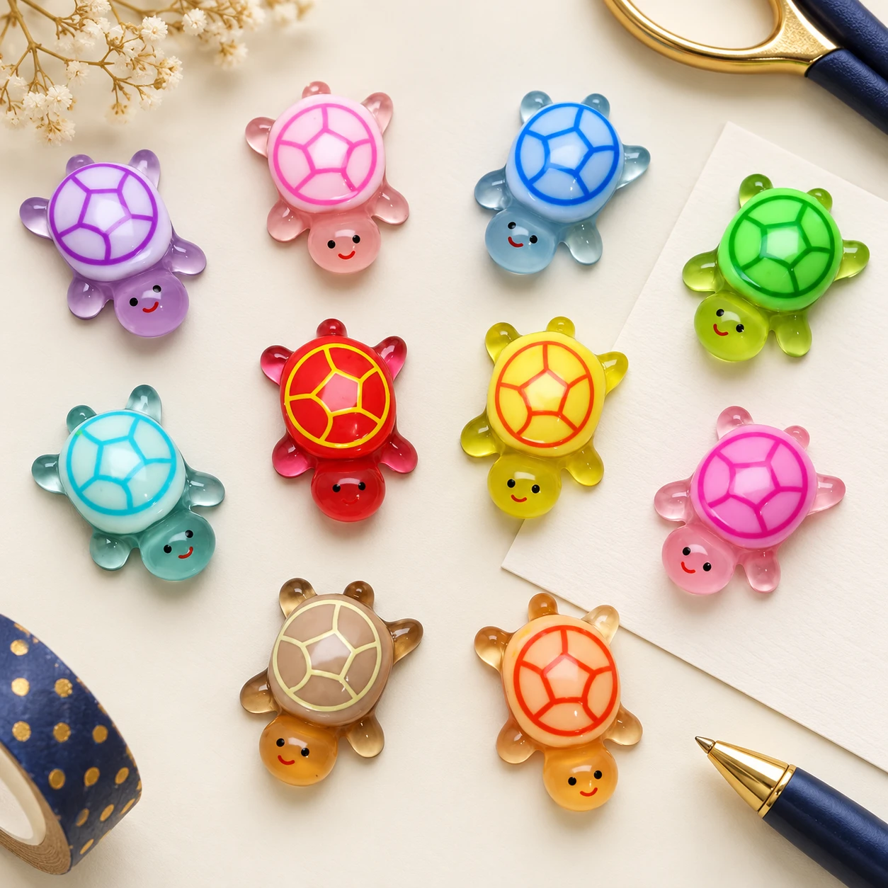 Colored Shell Turtle Resin Charms RW26057-1 in an illustrative craft workspace