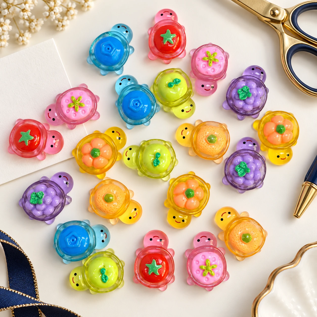 Flower Shell Turtle Resin Charms RW002868 in an illustrative craft workspace