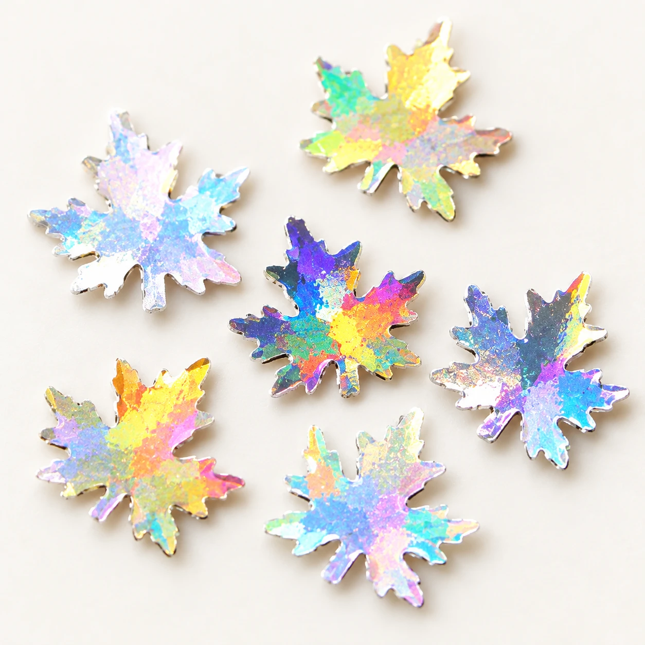 Holographic Maple Leaf Sequins MA129 close-up showing the decorative shape and finish