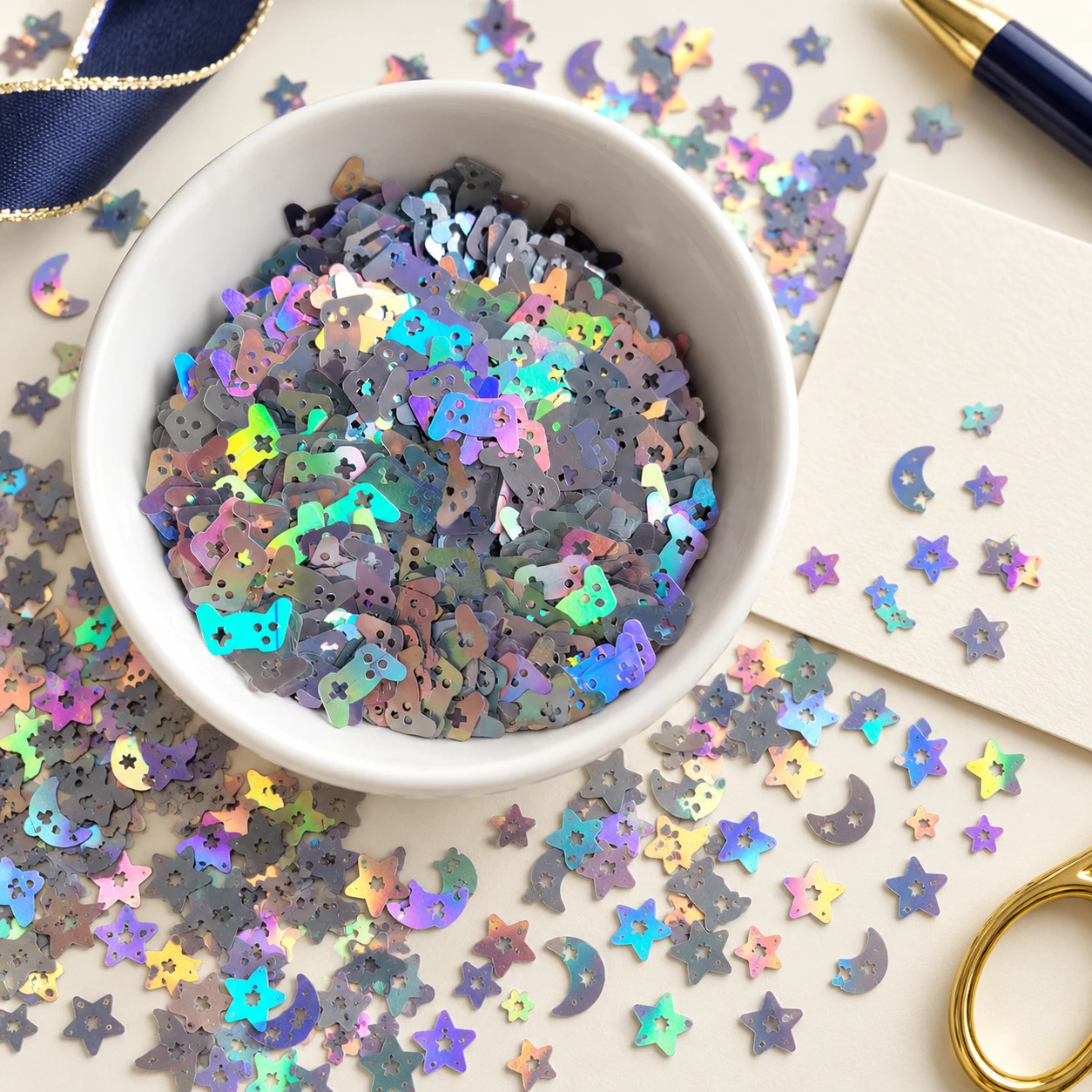 Holographic Star and Moon Sequin Mix MA293 in an illustrative craft workspace