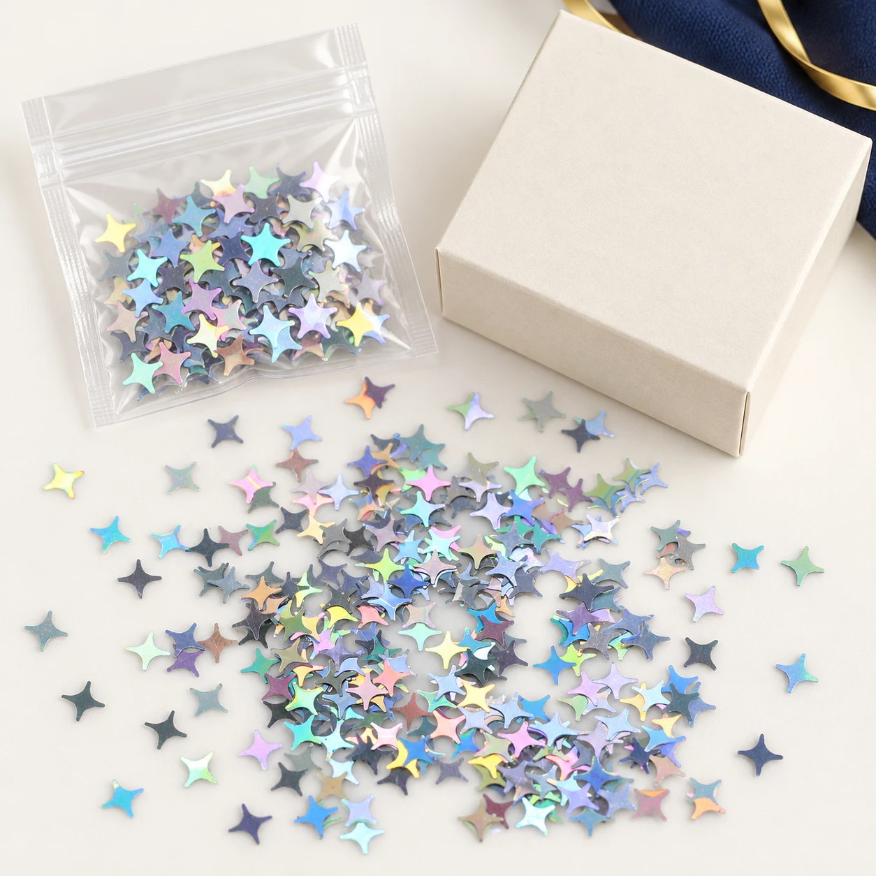 Iridescent Four-Point Star Sequins MA033 with illustrative private-label packaging