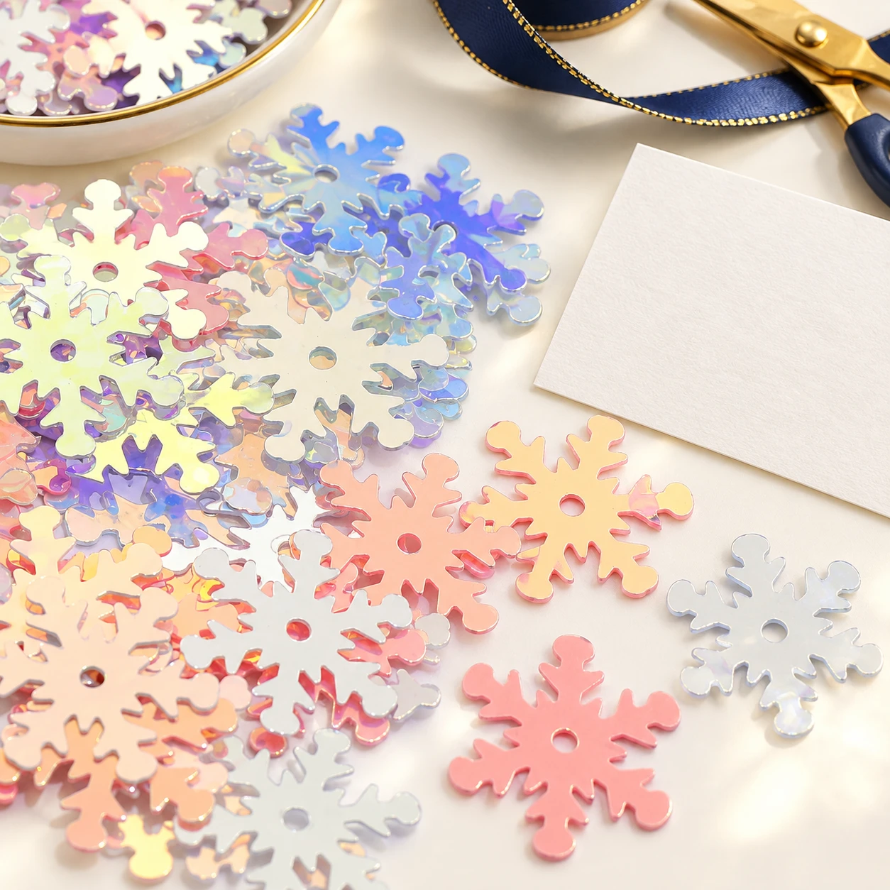 Large Iridescent Snowflake Sequins MA100 in an illustrative craft workspace