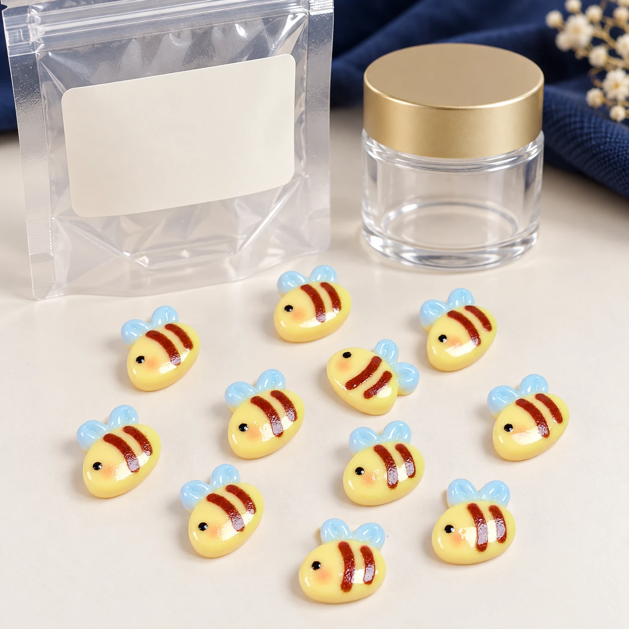Mini Bee Resin Flatback Cabochons RW002498 with illustrative private-label packaging