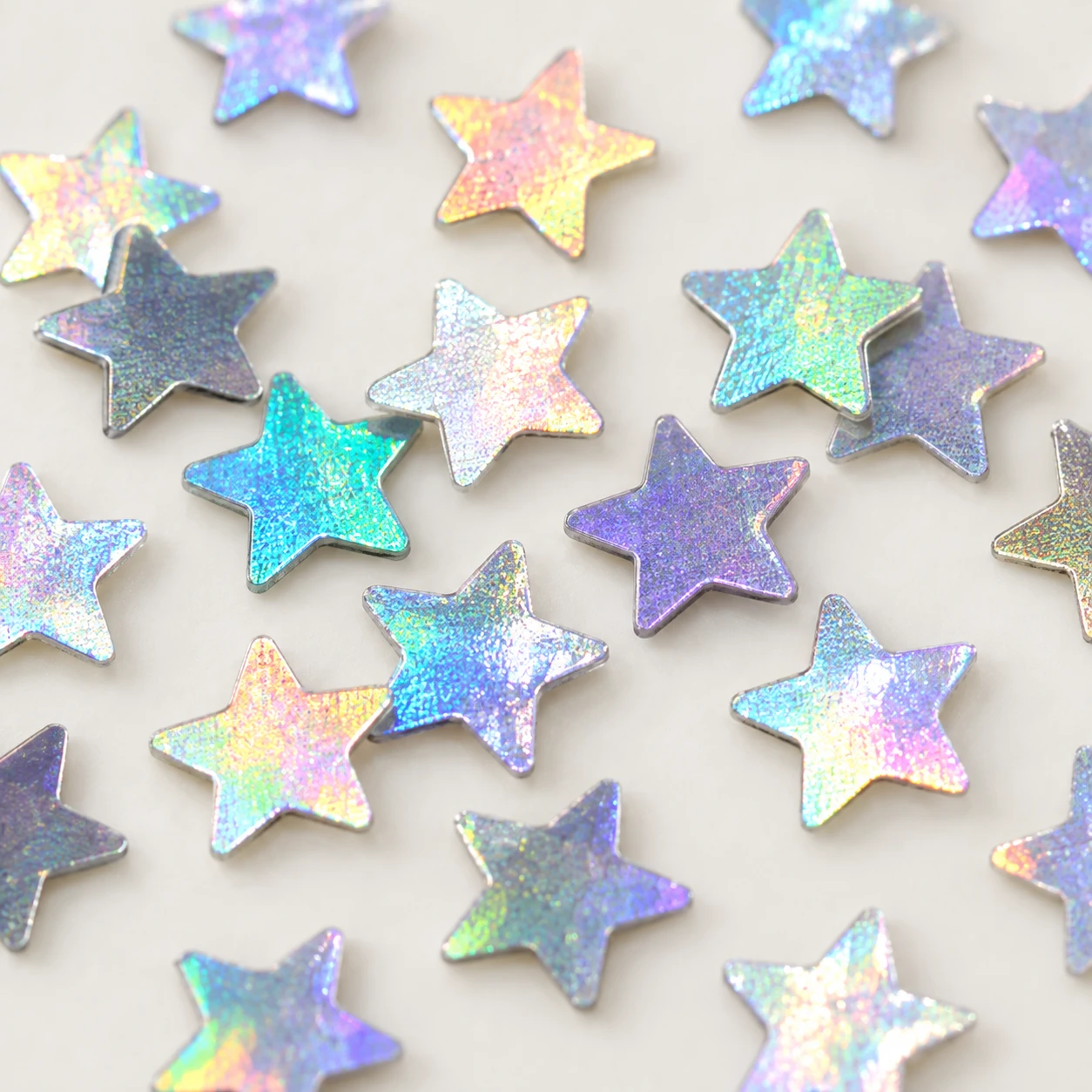 Mini Iridescent Star Sequins MA072 close-up showing the decorative shape and finish