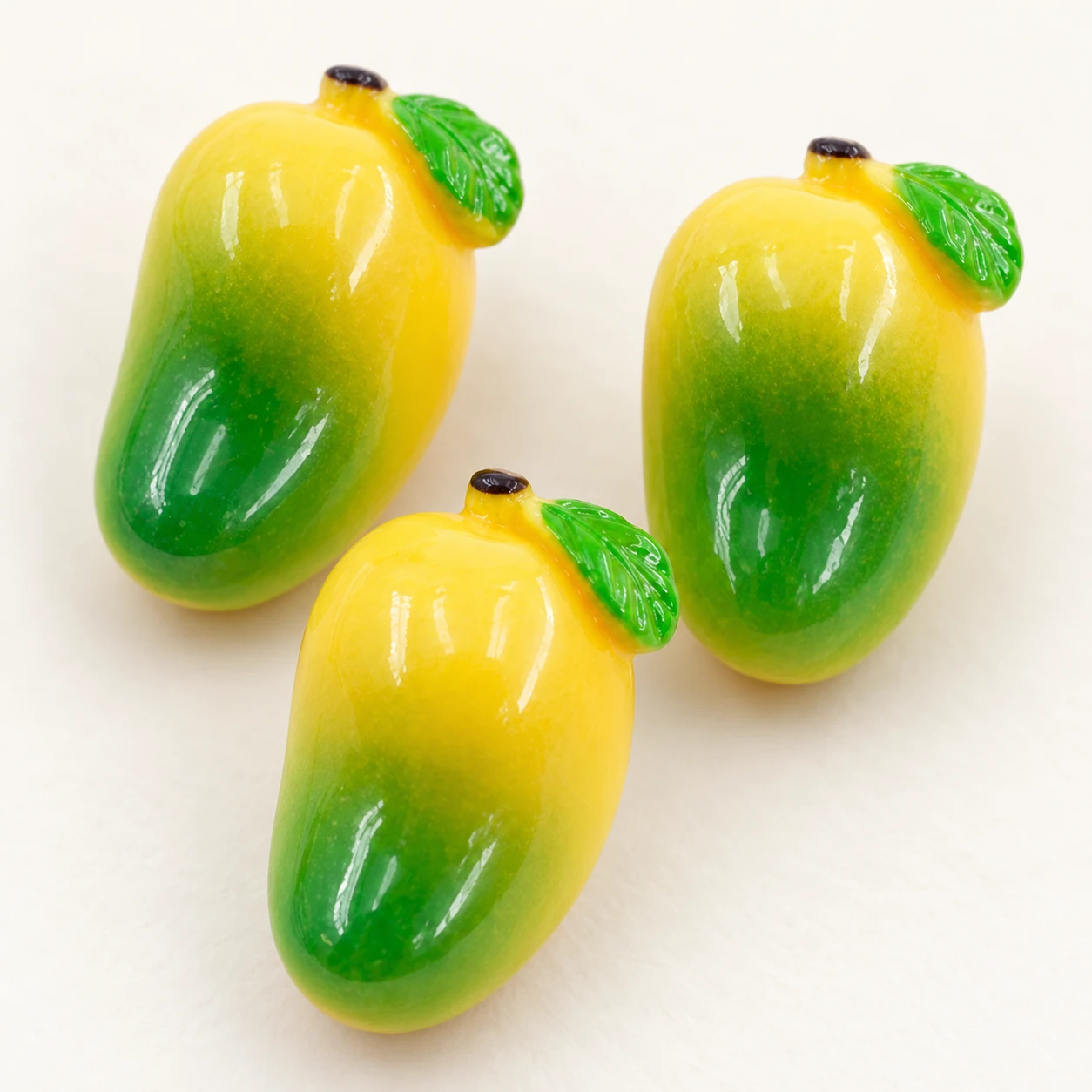 Mini Mango Resin Charms RW0023325 close-up showing the decorative shape and finish