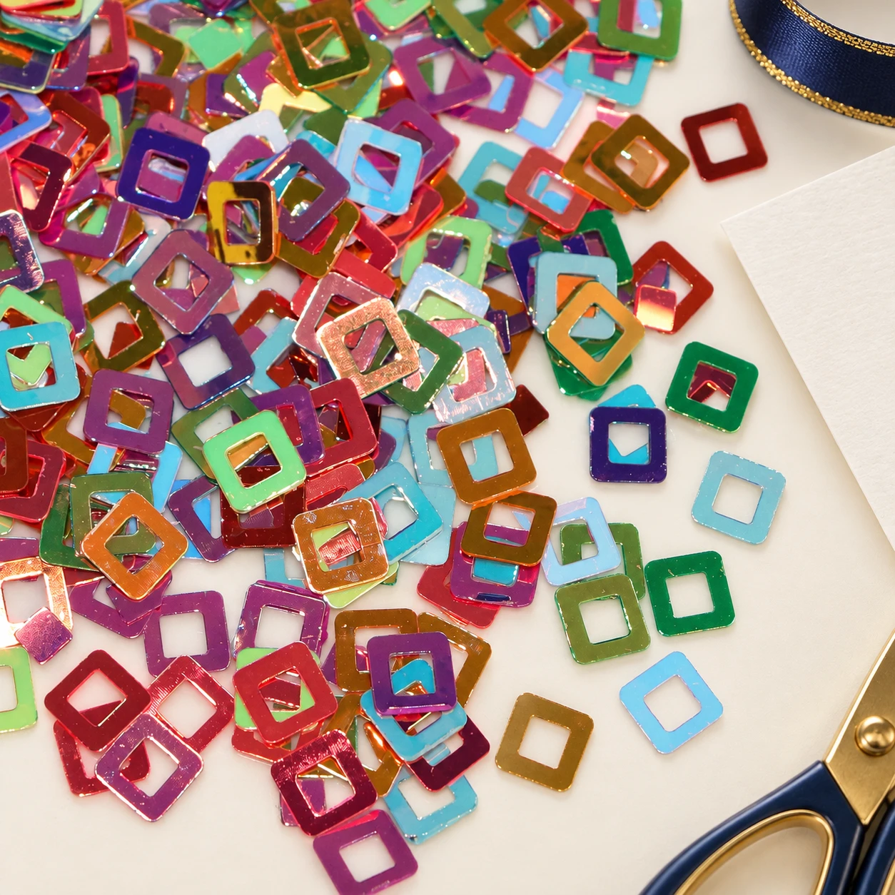 Multicolor Hollow Square Sequins MA009 in an illustrative craft workspace