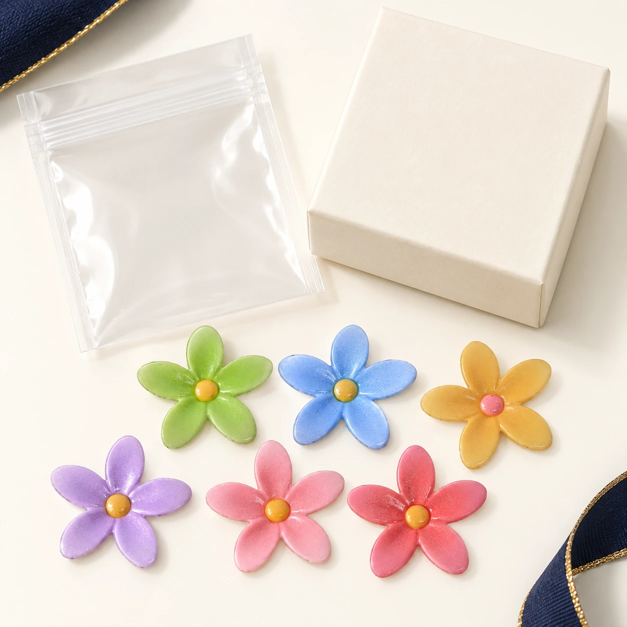 Pastel Five-Petal Flower Resin Charms RW00575 with illustrative private-label packaging