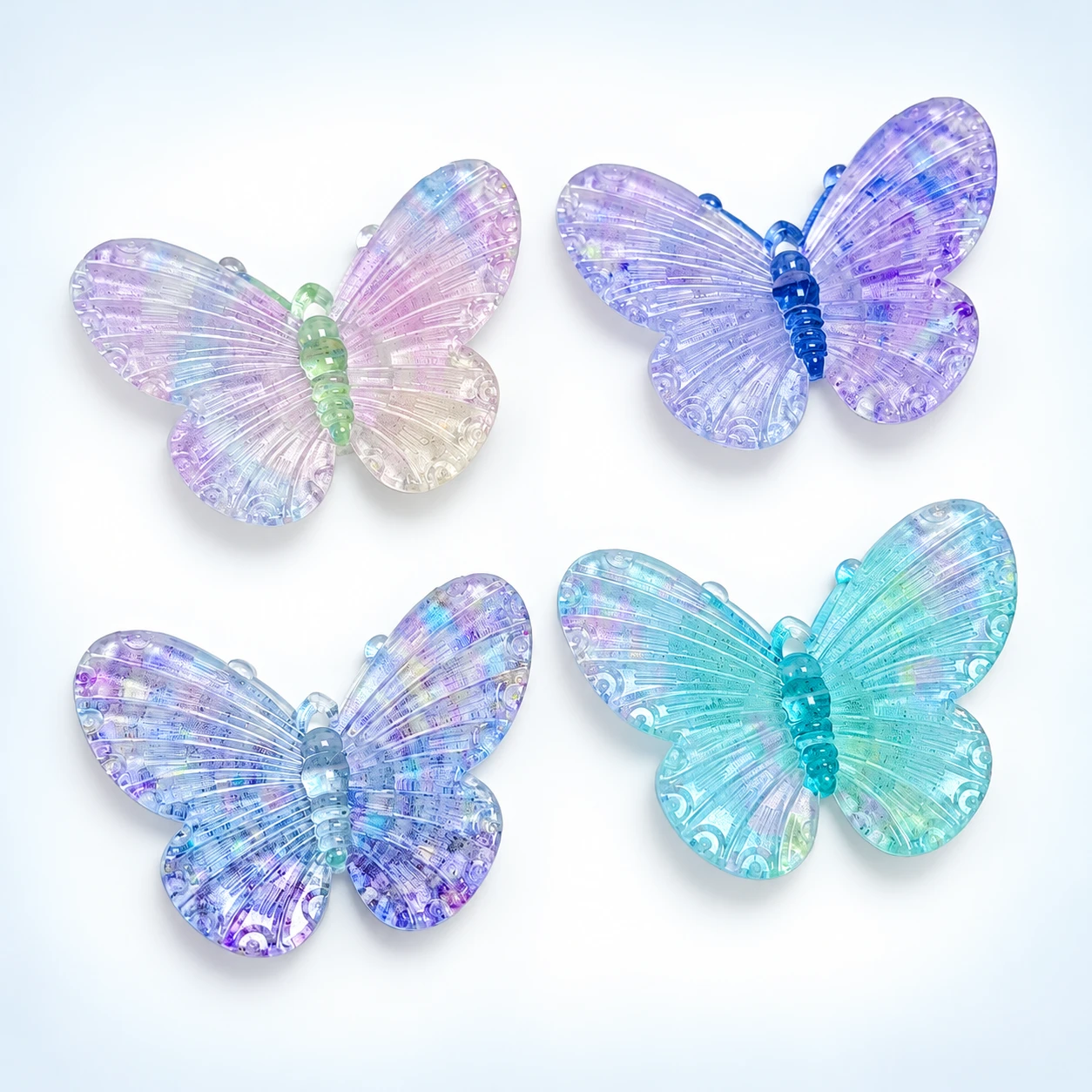 Pastel Iridescent Butterfly Resin Charms RW002654 / RW26619 on a clean light studio background
