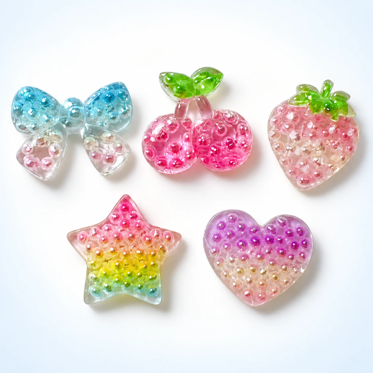 Pearl-Effect Fruit Heart and Star Resin Charms RW003334 on a clean light studio background