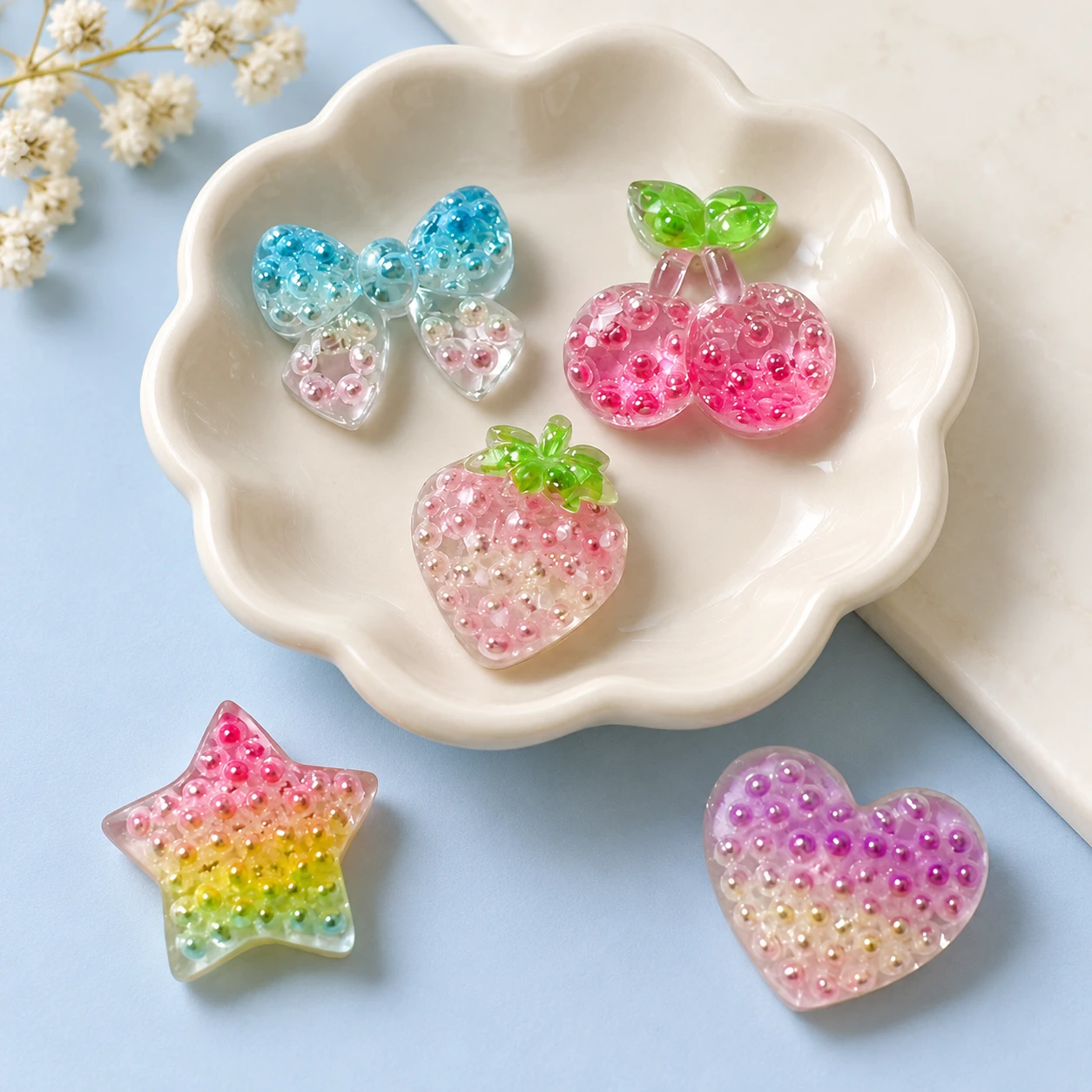 Pearl-Effect Fruit Heart and Star Resin Charms RW003334 displayed for assortment selection