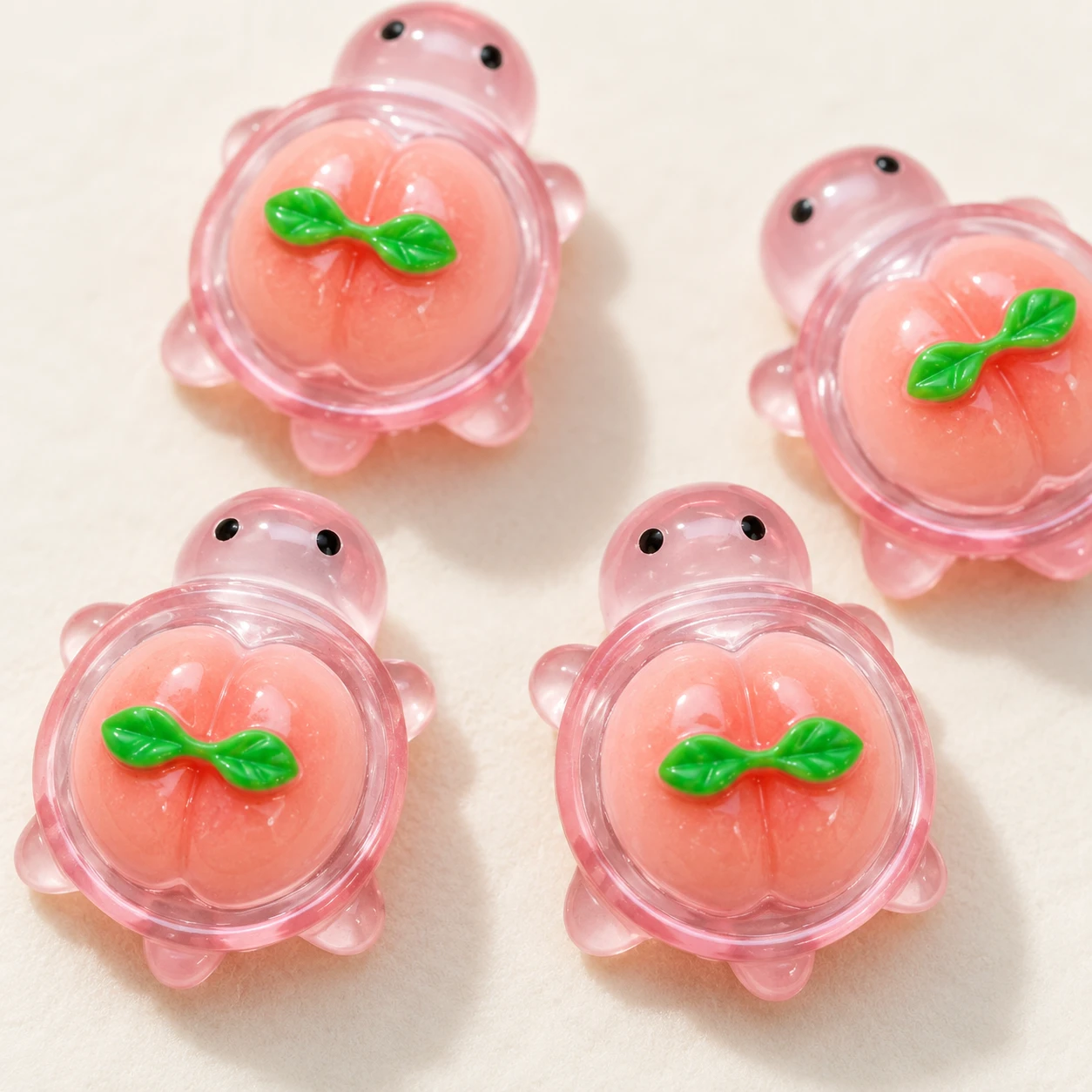Pink Peach Turtle Resin Charms RW003390 close-up showing the decorative shape and finish
