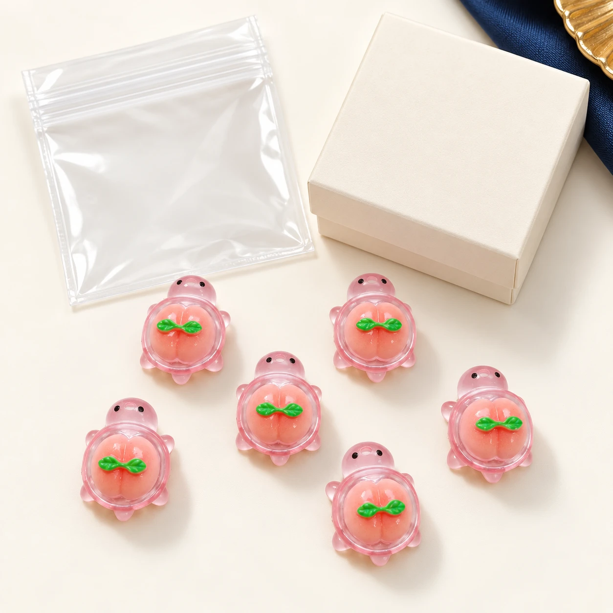 Pink Peach Turtle Resin Charms RW003390 with illustrative private-label packaging