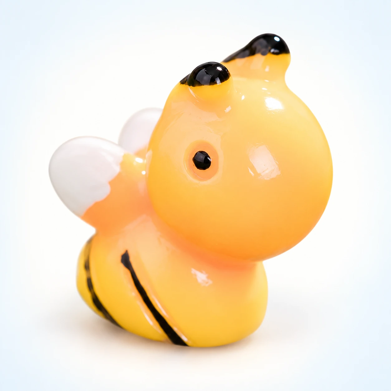 Rounded Bee Resin Charm RW002203 on a clean light studio background