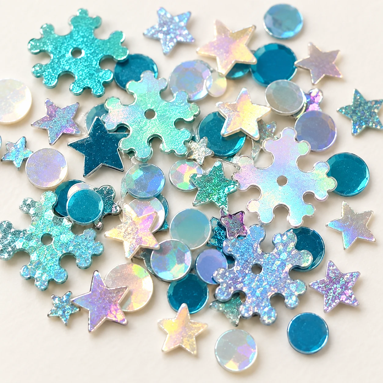 Teal Star and Snowflake Sequin Mix MA154 close-up showing the decorative shape and finish