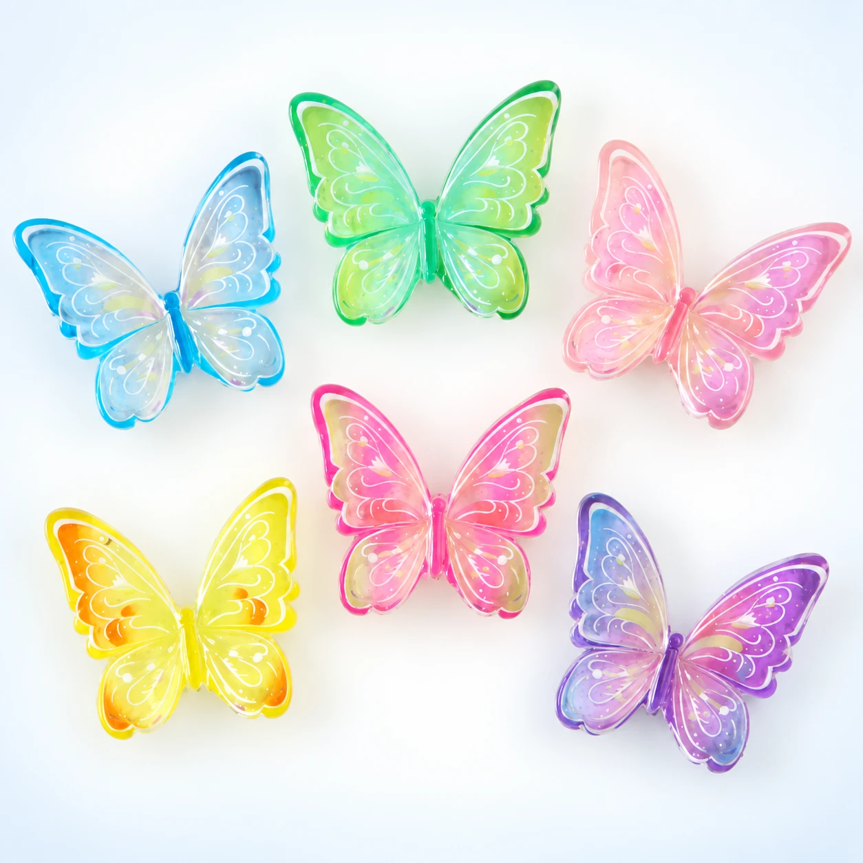 Translucent Butterfly Resin Charms RW003309 on a clean light studio background