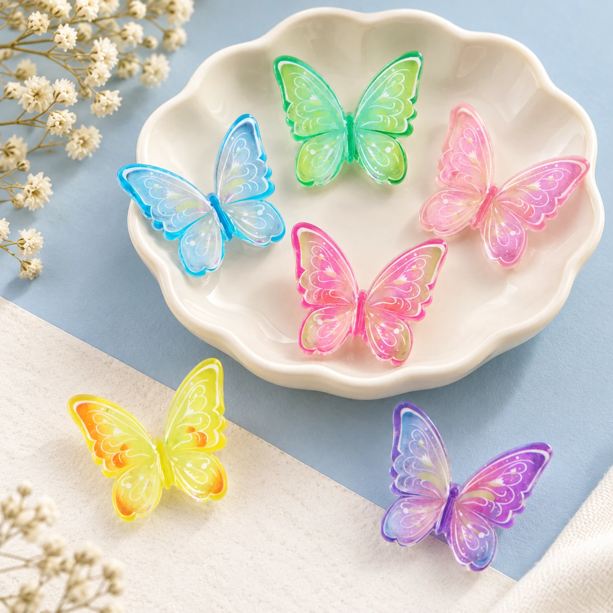 Translucent Butterfly Resin Charms RW003309 displayed for assortment selection