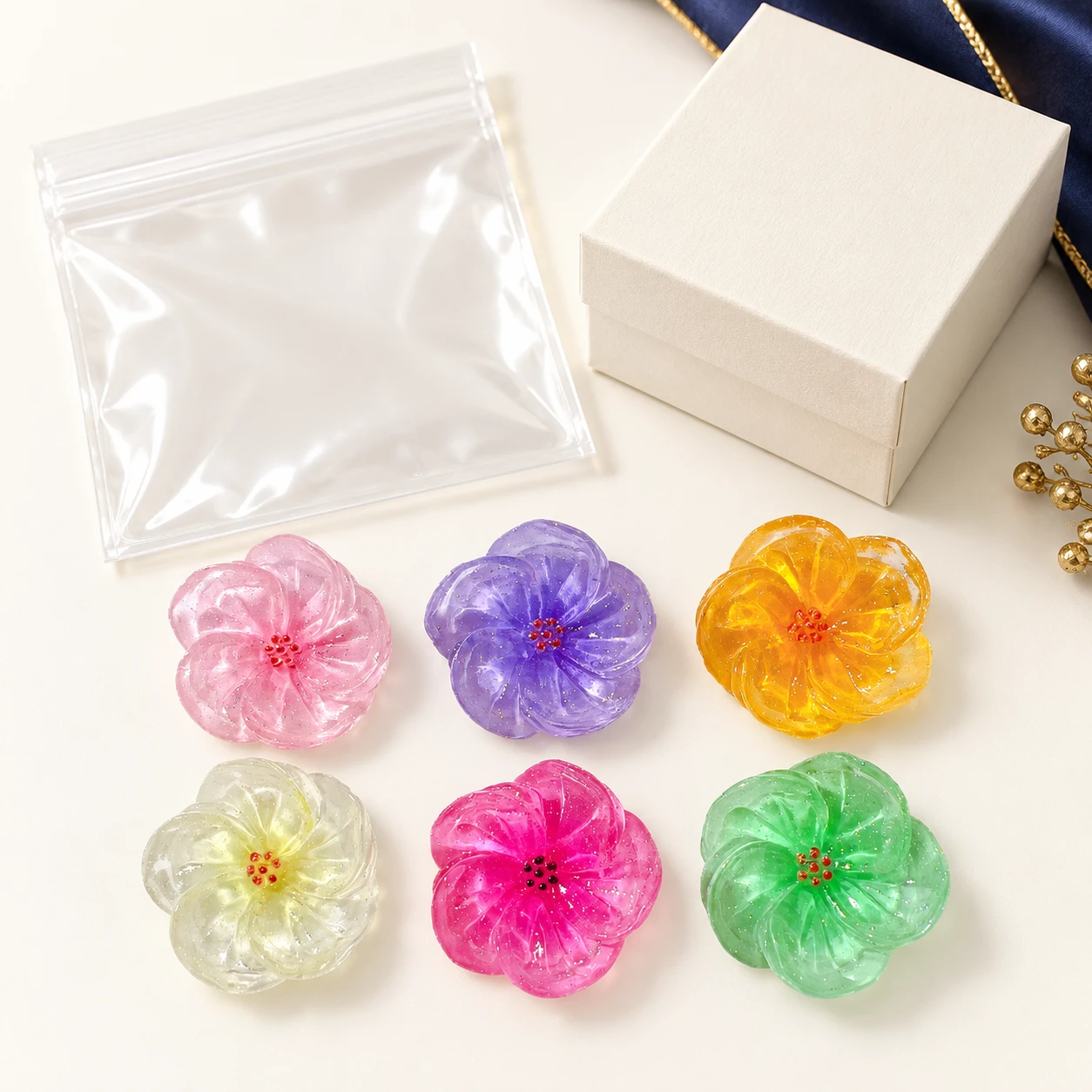 Translucent Glitter Flower Resin Charms RW0022500 with illustrative private-label packaging