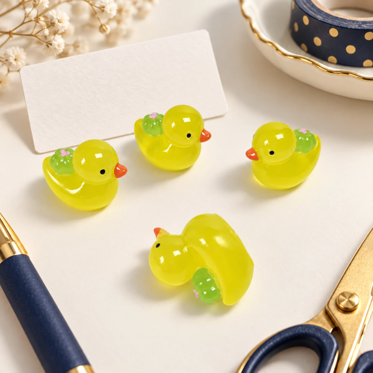 Yellow Duck Resin Charms RW001953 in an illustrative craft workspace