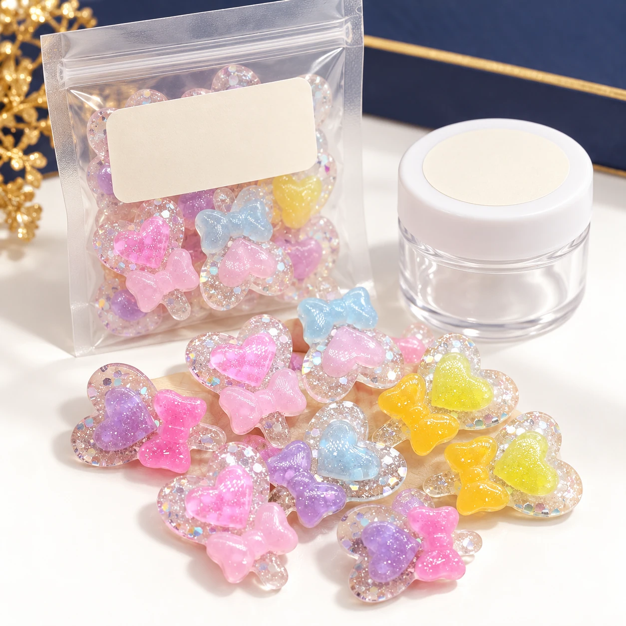 Glitter Heart & Bow Resin Charms with a clear pouch and sample jar for private-label packaging, RW2041