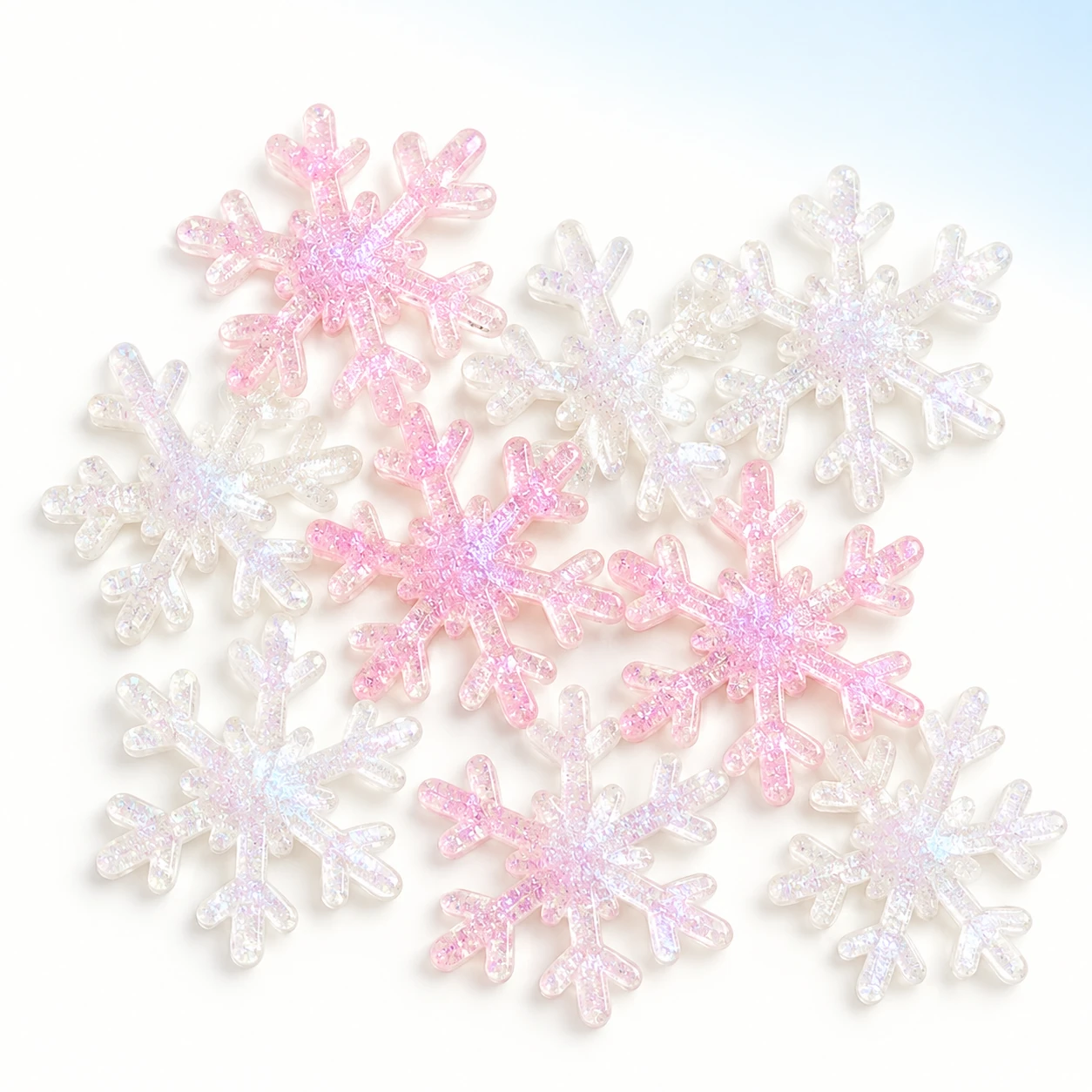 Iridescent Snowflake Resin Charms on a bright white studio background, RW24359