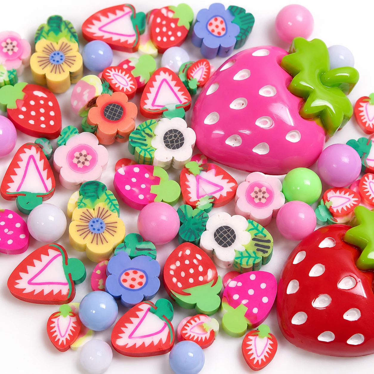 Close-up concept of strawberry charms, printed flower pieces and pastel beads in filler mix SLM26565