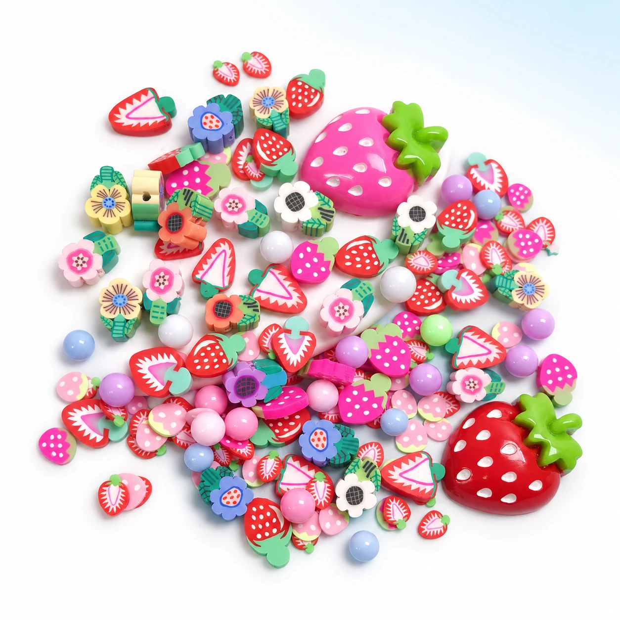 Strawberry and flower filler mix with pink and red strawberry charms on a bright white studio background, SLM26565